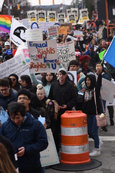 Marchers make their way down South Street during Moral March on Raleigh on Saturday, Feb. 9, 2019.