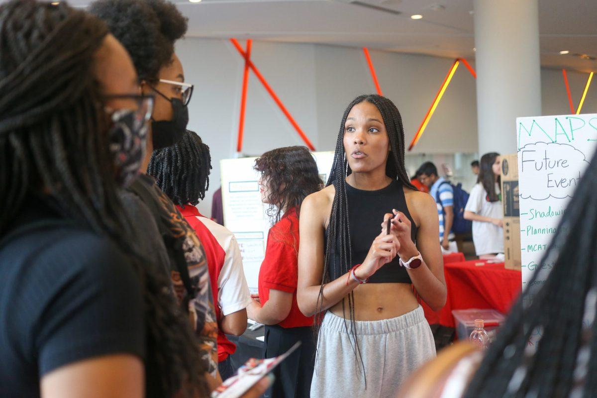 Ruby Carter-Ogden, a third-year in microbiology, talks with students about the MAPS group, Minority Association for Pre-Health Students, during the Back 2 School Jam in Talley Student Union on Wednesday, Aug. 24, 2022.