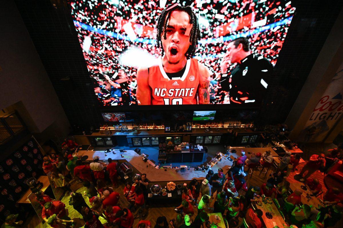 An ACC Tournament celebration reel plays at the Selection Sunday watch party in Sports &amp; Social on Sunday, March 17, 2024. NC State landed the No. 11 seed in the South Region in the NCAA Tournament.