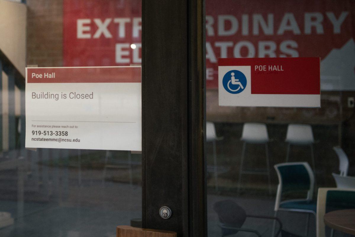 A sign on the doors marks the continued closure of Poe Hall on Wednesday, Jan. 24, 2024. Poe Hall was closed in November 2023 due to the presence of environmental contaminants (PCBs).