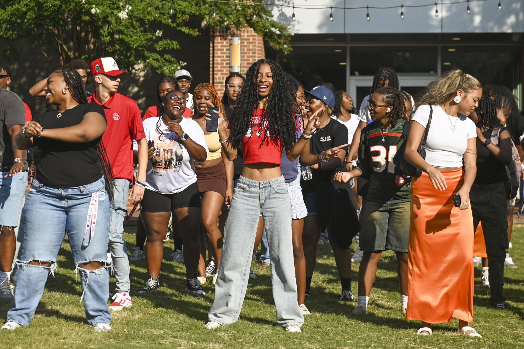 Students dance together during the Welcome Week Cookout on Harris Field on Thursday, Aug. 22, 2024. Students danced to songs like "Wobble" by V.I.C and "Flex" by Cupid at the event held by Black Students Board.