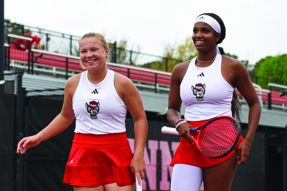 Freshman Diana Schnaider (left) and graduate Alana Smith (right) smile after winning their doubles match against Georgia Tech at Dail Outdoor Tennis Stadium on Friday, March 3, 2023. Schnaider won silver in Women's Tennis Doubles during the Paris 2024 Olympics.