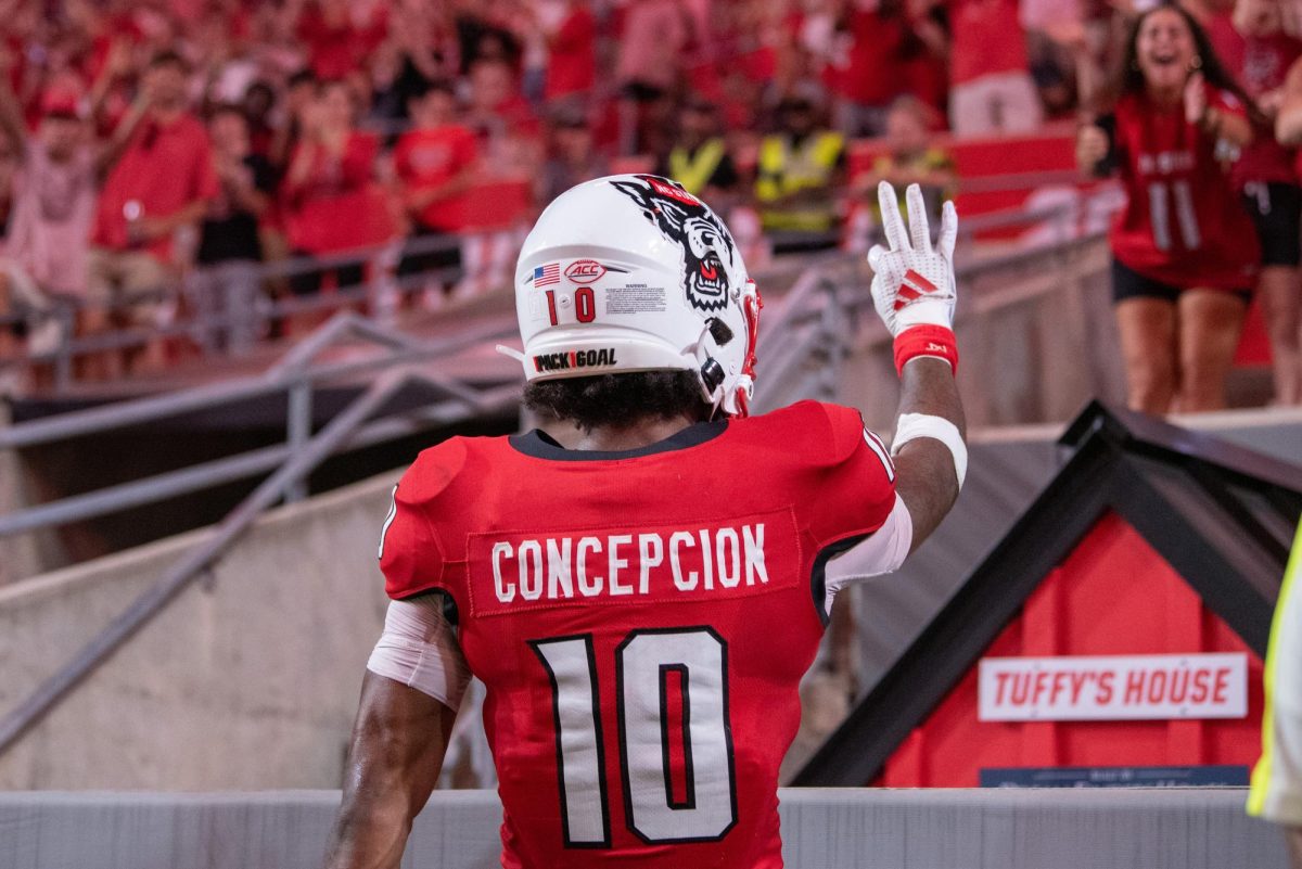 Sophomore wide receiver KC Concepcion celebrates with the crowd after scoring his third touchdown during the game against Western Carolina in Carter-Finley Stadium on Thursday, August 29, 2024. The Wolfpack defeated the Catamounts 38-21.