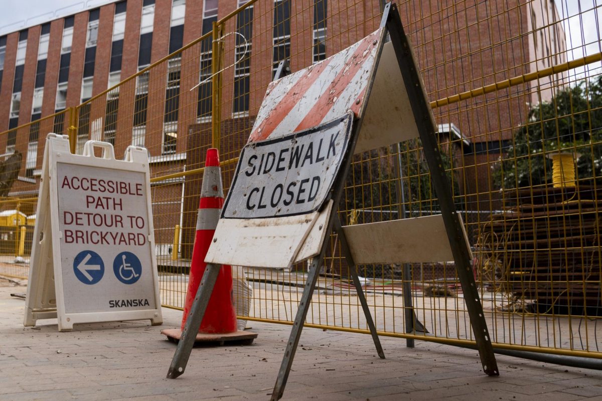 Signs indicate blocked path due to construction near Kathrine Stinson Drive on Friday, Aug. 30, 2024. A rise in construction across campus has raised concern for accessibility.