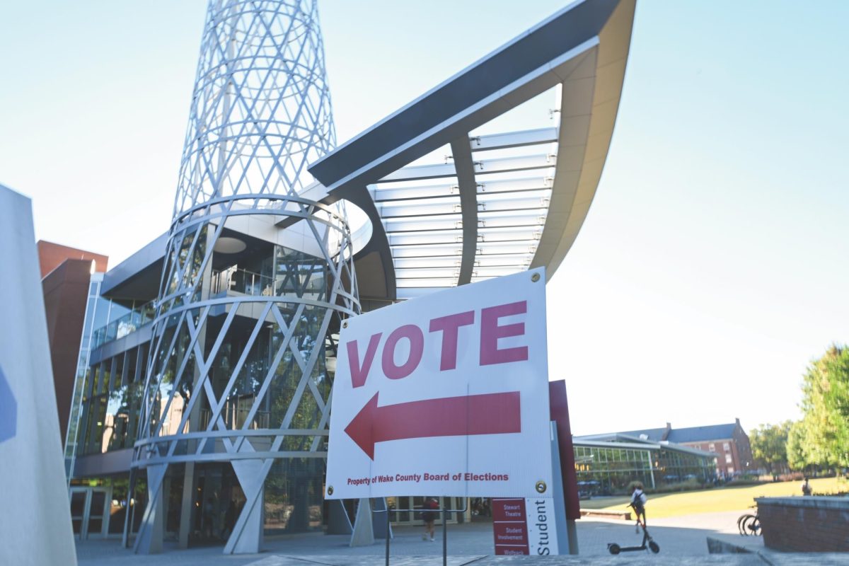 A sign directs voters towards the Talley Student Union on Monday, Oct. 21, 2024. Talley Student Union serves as an early voting center for Wake County voters.