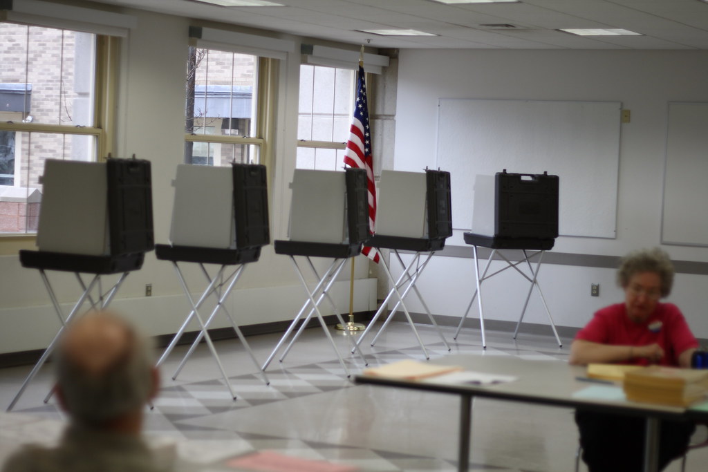 Image of voting booths from Creative Commons.