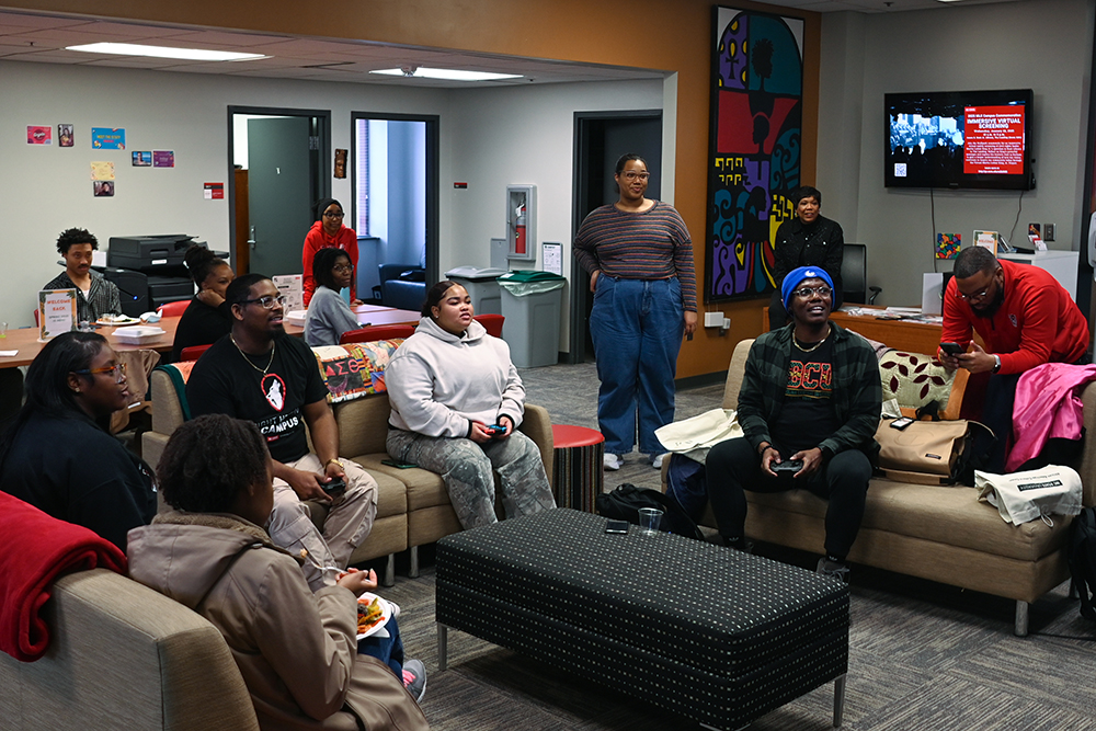 Students and faculty play a few rounds of Mario Kart during the African American Cultural Center Open House in Witherspoon Student Center on Friday, Jan. 10, 2025. The event introduced new members of the Wolfpack to their peers, faculty members, and the center's shared spaces.