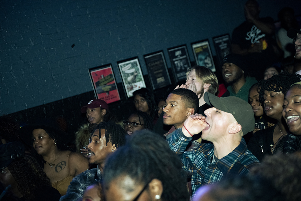 The crowd yells during the House of Art benefit show at The Pour House on Tuesday, Jan. 14, 2025. The show filled The Pour House to capacity with a line of people still waiting outside.