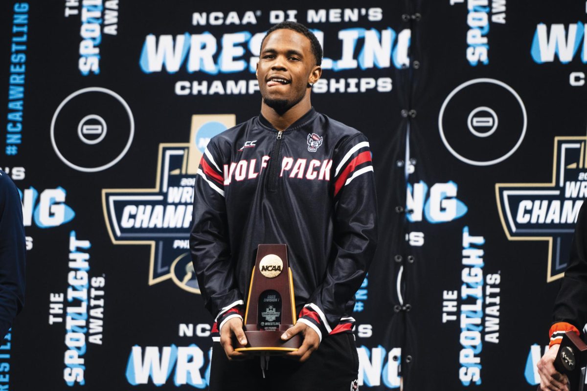 Vince Robinson with his trophy at the NCAA Wrestling Championship Tournament in the Wells Fargo Center on Thursday, March 20, 2025