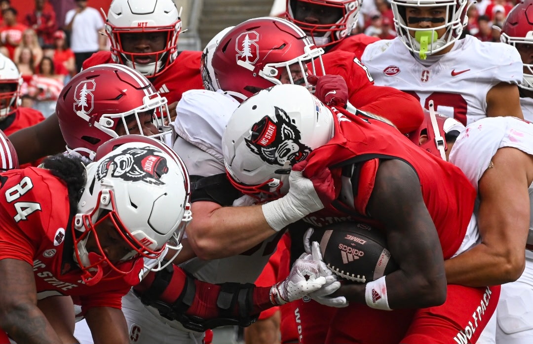 Graduate running back Jordan Waters pushes through the defense with the ball during the game against Stanford at Carter-Finley Stadium on Saturday, Nov. 2, 2024. Waters ran 115 yards during the game. NC State beat Stanford 59-28.
